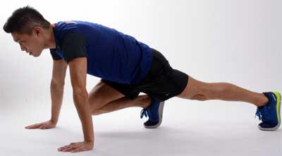 Man Doing Mountain Climber Body Weight Exercise at Home