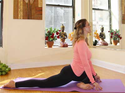 Woman Doing Yoga at Home with Only a Mat